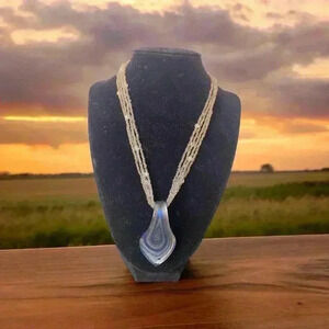 Art Glass Necklace in a Sea of Blue on a 4 Strand of White Gray Small Beads